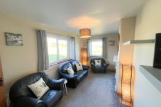 Honeybee Cottage Valentia Co Kerry. Cosy dining room, comfortable seating. 