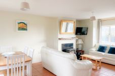 Seacliff Holiday Home No 43. Dining, living room open space with stove. 