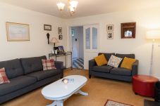 Aughrim Holiday Village No. 14. Aughrim holiday village. Living room, modern comfortable sofas, coffee table. 