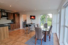 Riverrun Holiday Home No 15. Open plan kitchen dining area with views to garden from large window. 