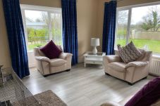 Ballygarrett Holiday Home, County Wexford. Bright living room, contemporary furnishing. 