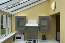 Clifden Glen Holiday Village No 11. Clifden Co Galway.  Compact Kitchen with all appliances. View to garden.