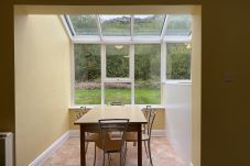 Clifden Glen Holiday Village No 11. Clifden Co Galway. Dining 6 seats view to rear garden. Conservatory. 
