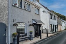 Passage East, Co Waterford. Family holiday home, opens onto street. Close to ferry. Within village all facilities and walking distance to ferry. 