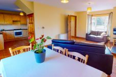 Seacliff Holiday Home No. 12. Dunmore East, County Waterford, Ireland. Dining table, open plan living room.