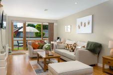 Clifden Town Apartment.Well finished modern interior lounge with access to garden. Patio doors. Comfortable furnishing. 