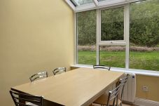 Clifden Glen Holiday Village No 11. Clifden Co Galway. Dining 6 seats view to rear garden.